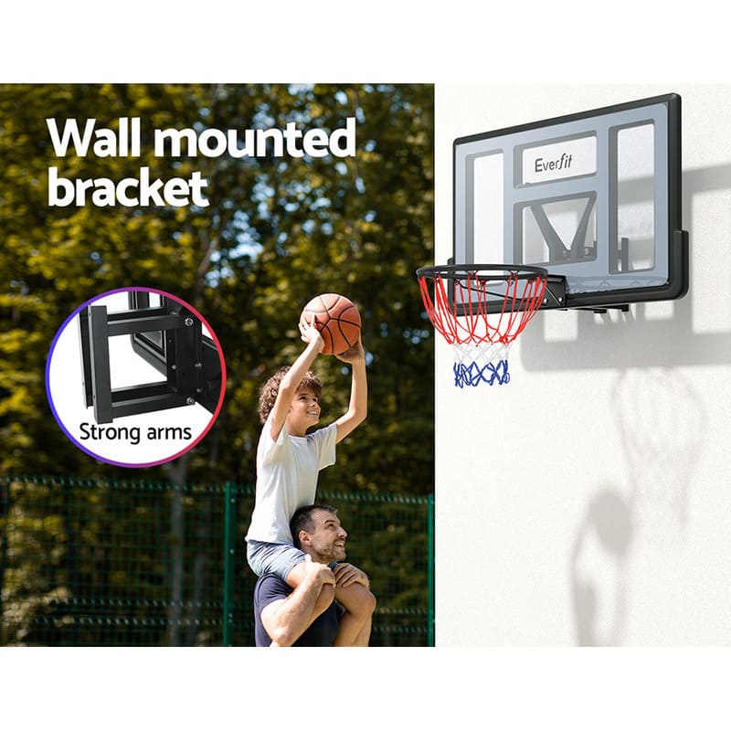 Boy on a man shoulder taking shot on Everfit 45 Inch basketball ring mounting on a white wall outside